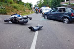 Motorcycle accident, crash at sunny day. Serious accident