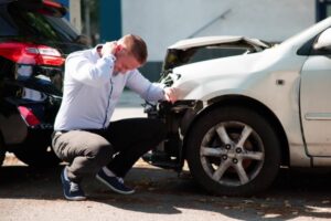 Young Male Seeks Compensation After Car Injury Causes Whiplash Pain.
