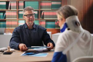 Personal Injury Lawyer Reviews Car Accident Claim With Female Client Today.